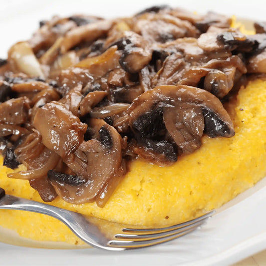 Polenta con funghi e fonduta alla birra ambrata