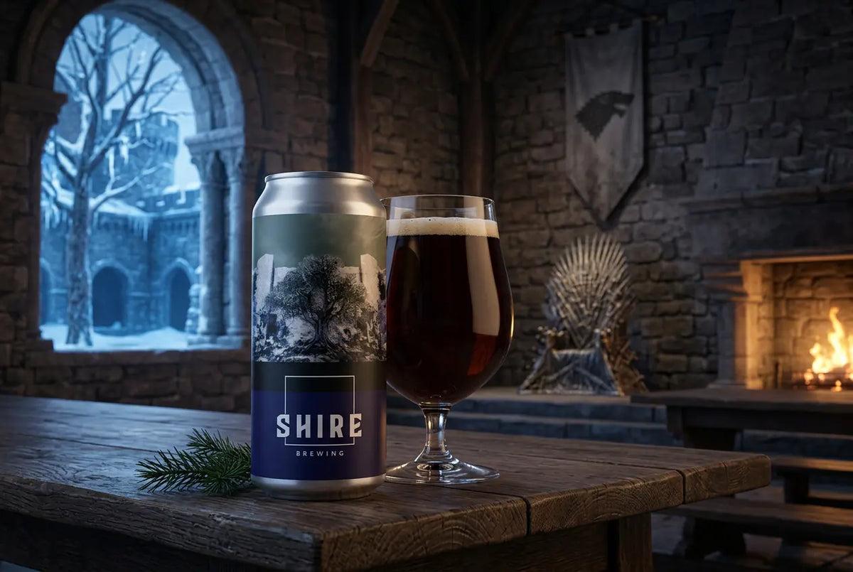 Winterfell Wee Heavy beer can and glass in a cozy, winter-themed setting with a fireplace.